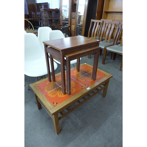 75 - A teak and tiled top coffee table and a teak nest of two tables