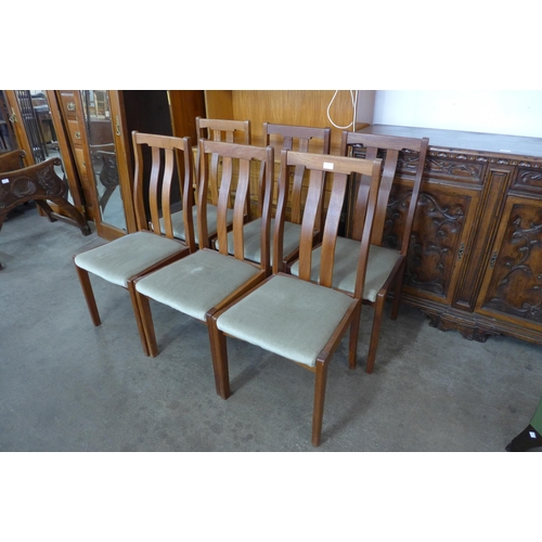 76 - A set of six teak dining chairs