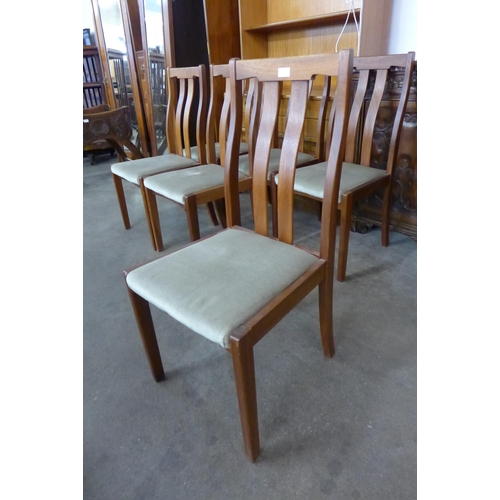 76 - A set of six teak dining chairs