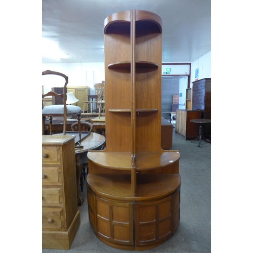 79 - A pair of Nathan teak freestanding corner cabinets