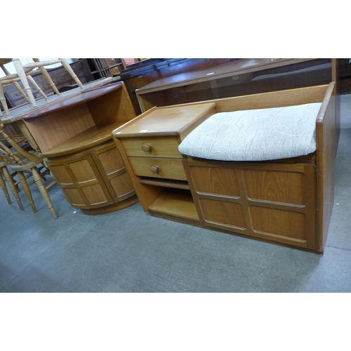 83 - A Nathan teak telephone seat and a corner cabinet