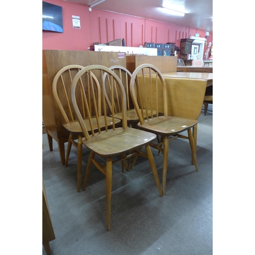 89 - A set of four Ercol Blonde elm and beech Windsor chairs