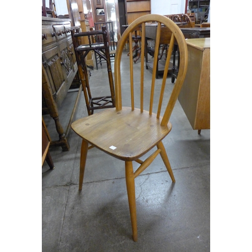 89 - A set of four Ercol Blonde elm and beech Windsor chairs