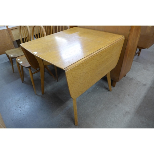 90 - A G-Plan Brandon light oak drop leaf table