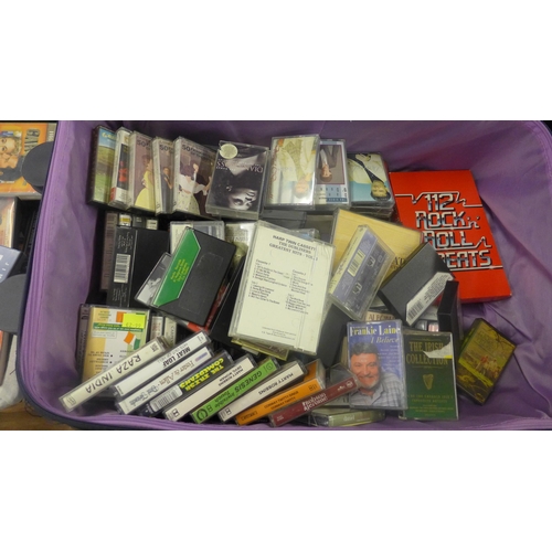 2104 - Picnic basket and 2 useable suitcases with approx 80 cassette tapes and 180CDs and DVDs