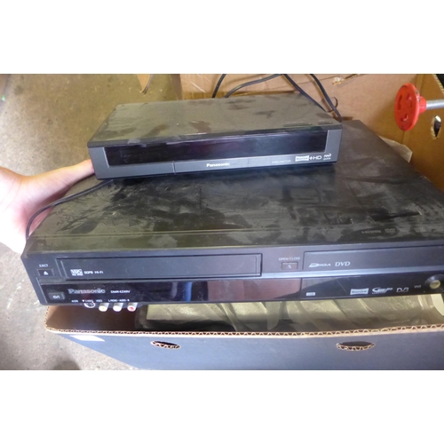 2151 - Panasonic Freeview box, Panasonic VHS/DVD player with approx 100 DVDs and 30 VHS tapes