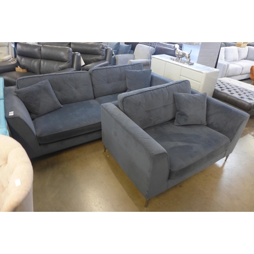 1312 - A space blue velvet and pinched back cushioned four seater sofa and loveseat