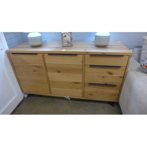 1329 - An Osaka oak and black metal two door three drawer sideboard