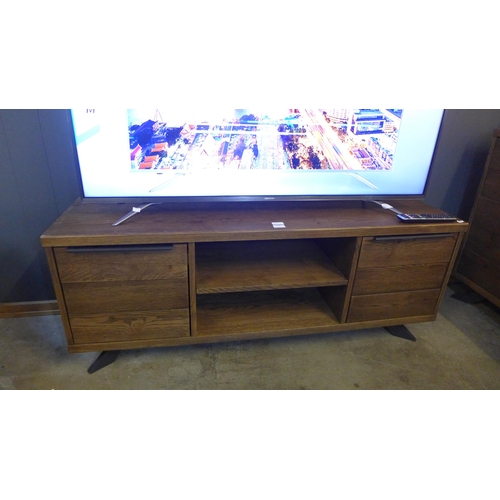 1373 - A Sapporo fixed top darkwood and black metal two door TV stand