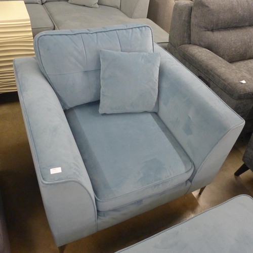 1443 - A sky blue velvet oversized armchair with footstool