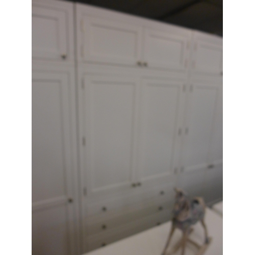 1485 - A large white painted 11 pc modular wardrobe, three double sections. two single sections and detacha... 