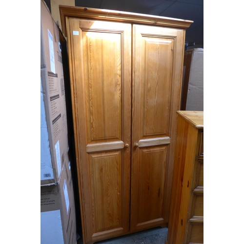 1561 - A pine double wardrobe and a pine two over five chest of drawers