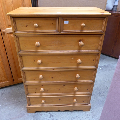 1561 - A pine double wardrobe and a pine two over five chest of drawers