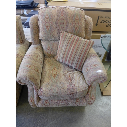 1570 - A Parker Knoll patterned two seater sofa and a pair of armchairs