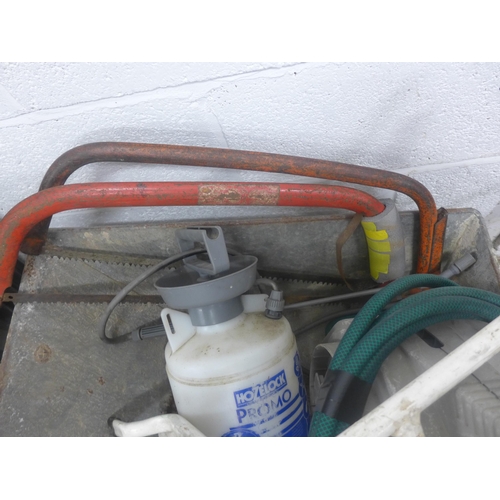 2295 - Wheel barrow with wall mounting hose pipe ladder stand of sprayer and 2 bow saws