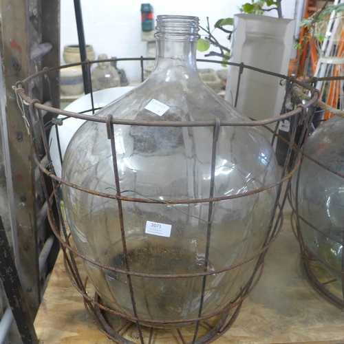 2071 - Glass carboy jar in metal cage