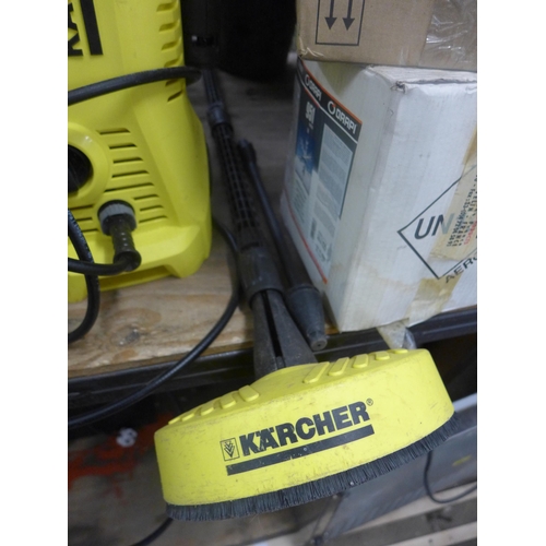 2073 - Karcher jetwash with two attachments and floor scrubber