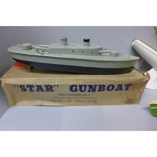 673 - A boxed Star clockwork gunboat, a Star speedboat and a Star yacht