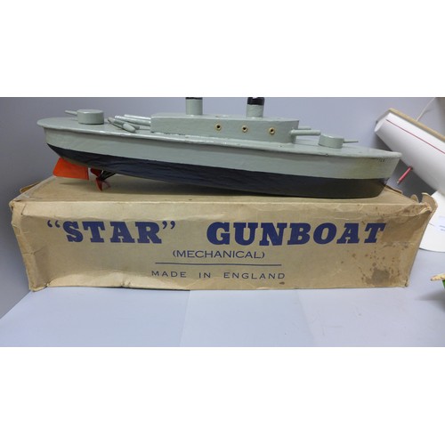 673 - A boxed Star clockwork gunboat, a Star speedboat and a Star yacht