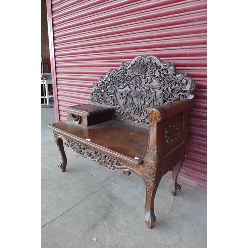 167 - A Burmese carved hardwood bench