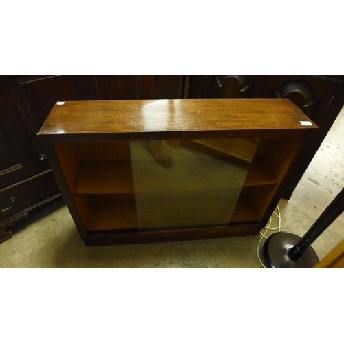 241 - An oak freestanding corner cabinet, a standard lamp, small bookcase, etc. (4)