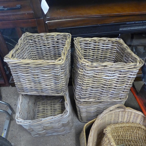 2285 - A collection of 8 wicker baskets ideal prop/window dressing