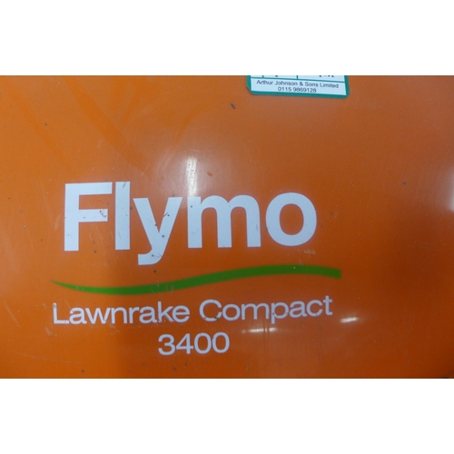 2319 - Cobra electric lawnmower and Flymo electric lawn rake 3400