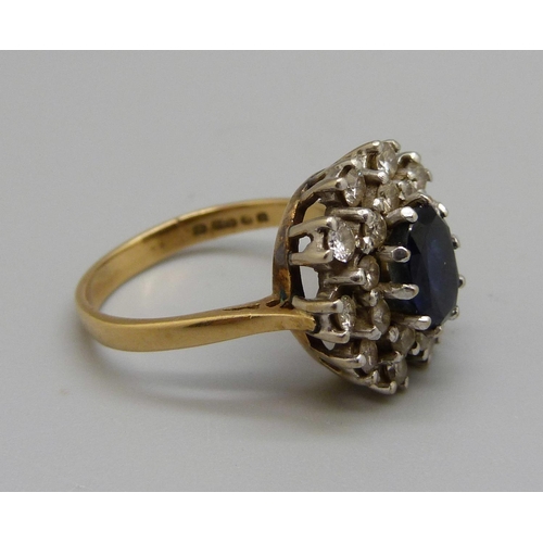 1012 - An 18ct gold sapphire and diamond cluster ring, 6.7g, O