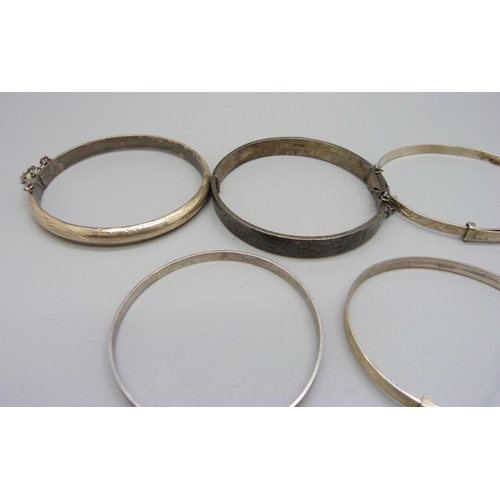 1023 - Six silver bangles, 54g, some smaller sizes