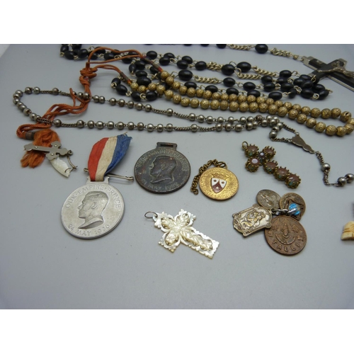 1037 - A crucifix, other cross pendants, a Stanhope, etc.