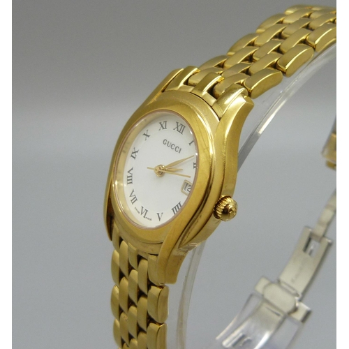 1065 - A lady's Gucci wristwatch, with a box