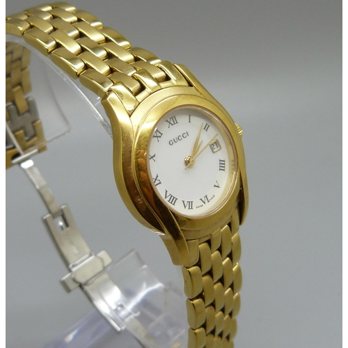 1065 - A lady's Gucci wristwatch, with a box