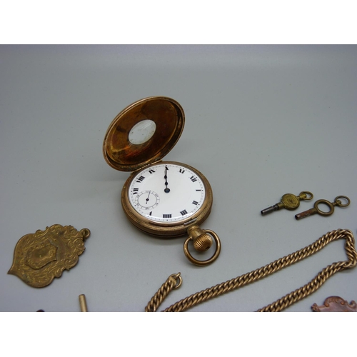 1071 - A gold plated Marvin half-hunter pocket watch, an Albert chain and four fobs