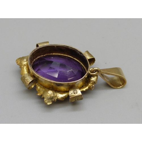 1080 - An antique yellow metal and amethyst pendant, stone 14mm wide