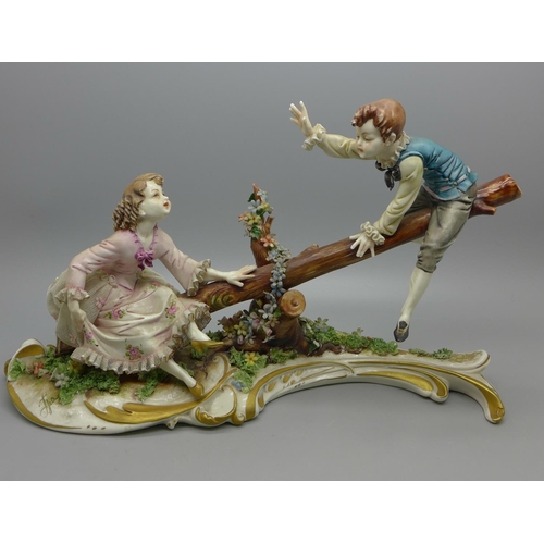 603 - A Capodimonte figure, Boy and Girl on a see-saw, signed