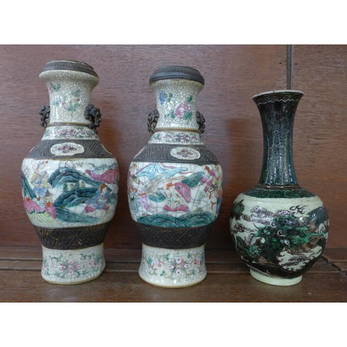 614 - A pair of Chinese vases, 26cm and one other (two each with a small chip to rim)