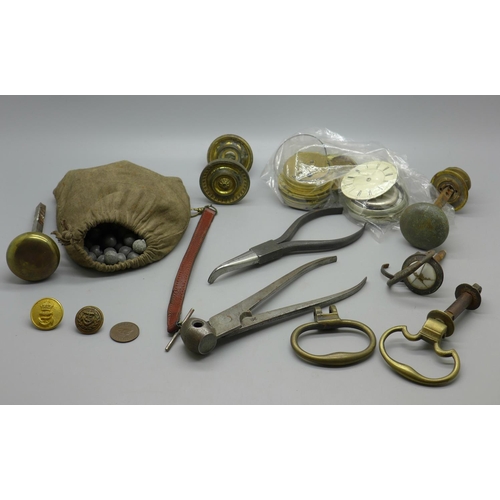 618 - Watch parts, cabinet knobs, a bag of shot and a bullet mould