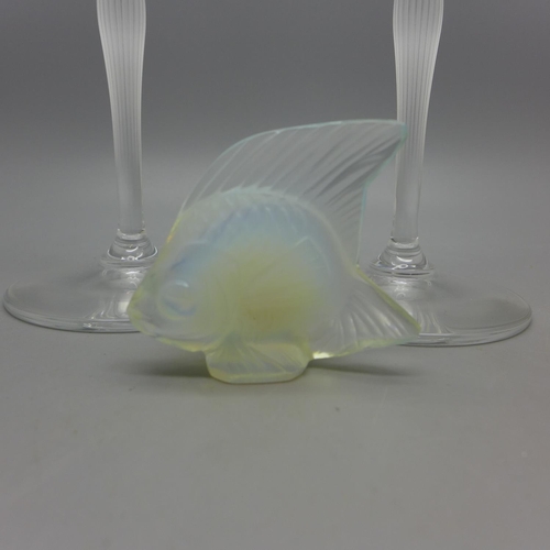 638 - A Lalique glass fish and two Lalique champagne flutes