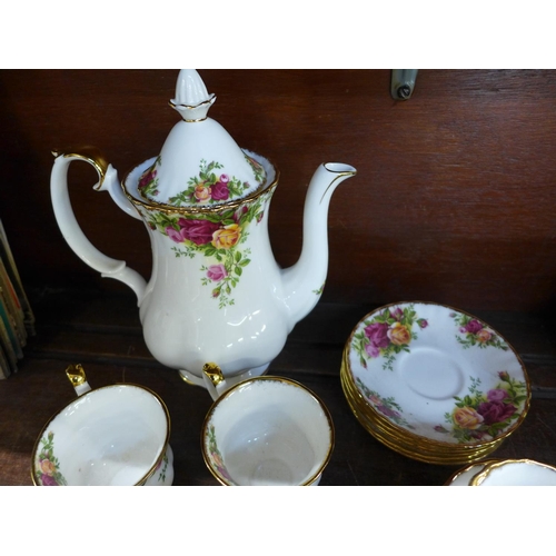 684 - A Royal Albert Old Country Roses coffee set, one saucer cracked