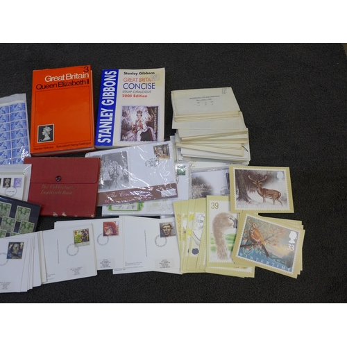 695 - A box of GB stamps, covers, catalogues, etc.