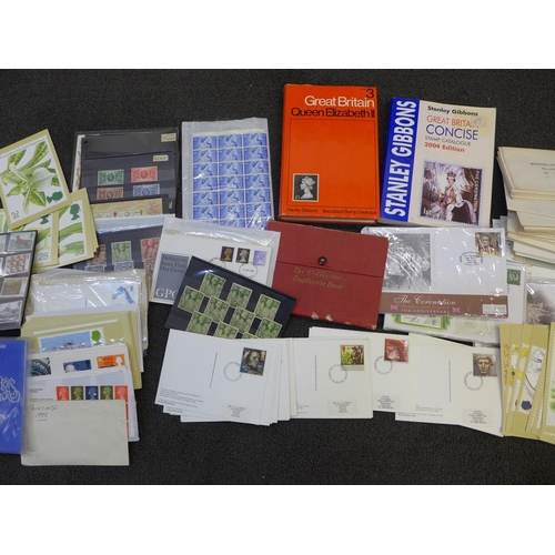 695 - A box of GB stamps, covers, catalogues, etc.