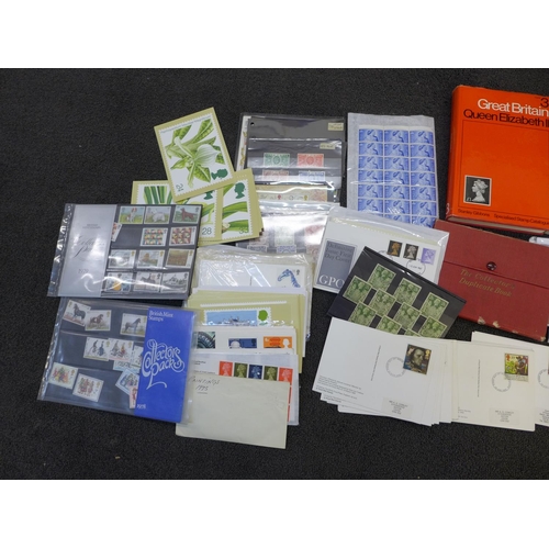 695 - A box of GB stamps, covers, catalogues, etc.