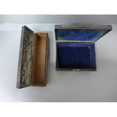 704 - Two oriental metal boxes embossed with dragons