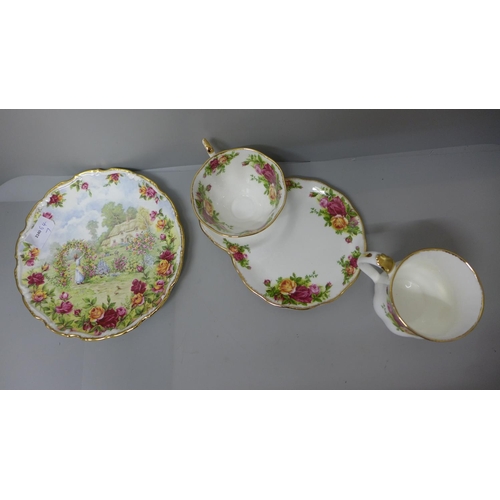 735 - A Royal Albert Old Country Roses cup and saucer, a mug and a Roses Garden plate