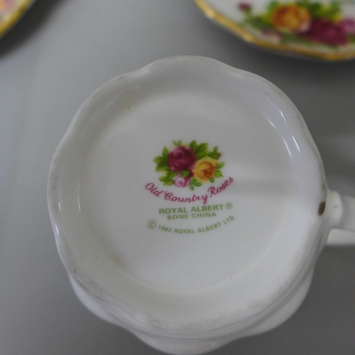 735 - A Royal Albert Old Country Roses cup and saucer, a mug and a Roses Garden plate