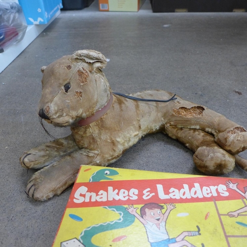 785 - A collection of vintage board games and an early 20th Century straw filled lion, a/f