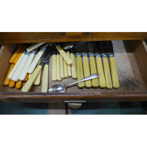 806 - Two cabinets, one wooden, containing a collection of flatware and two boxed sets of fish knives and ... 