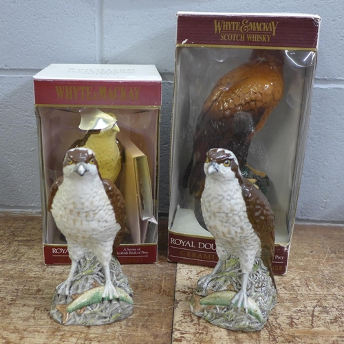 827 - Two Royal Doulton, Whyte & Mackay Birds of Prey Whisky decanters, (one with contents), and two Golde... 