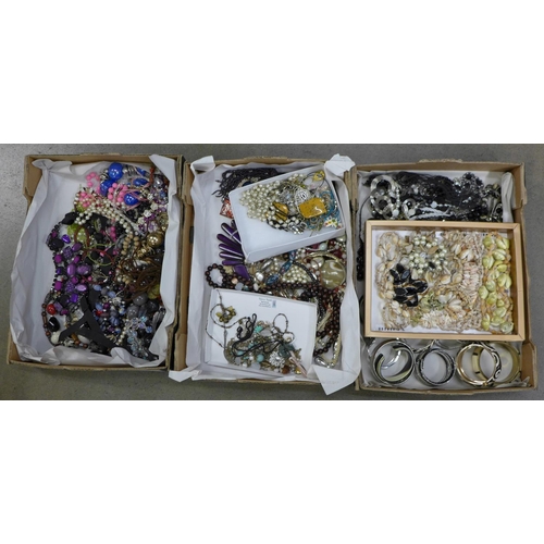 829 - A collection of jewellery including bangles in three boxes