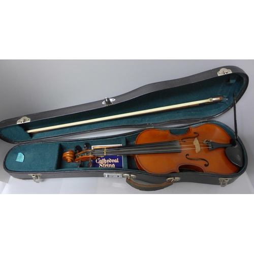 830 - A modern violin and bow, length of back 33.5cm, cased